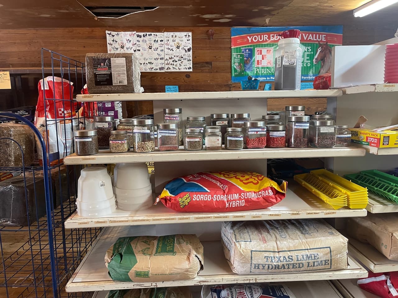 Jars of vegetable and garden seed on the shelf at Mustang Creek Feed Seed & Supply in Rio Vista, Texas