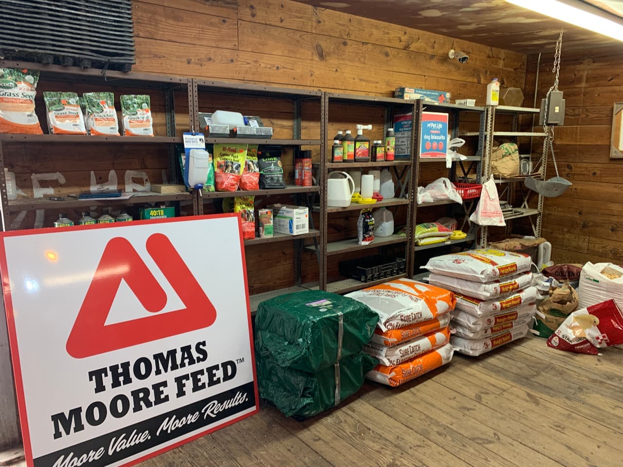 Grass seed and garden supplies on the shelf at Mustang Creek Feed Seed & Supply, an authorized Thomas Moore Feed dealer in Rio Vista, Texas
